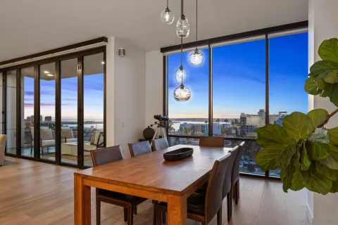 a view of a dining room with furniture and window