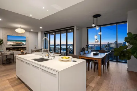 a kitchen with granite countertop a refrigerator and a sink
