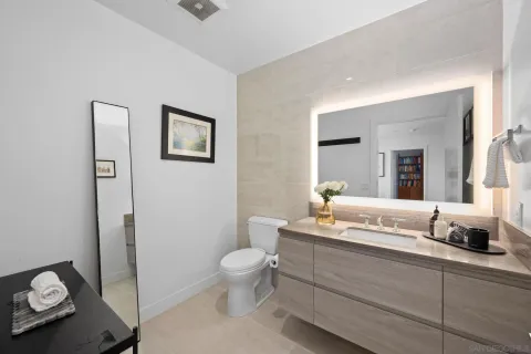 a bedroom with a bed and a mirror