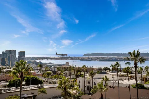 a bathroom with a granite countertop sink mirror and double