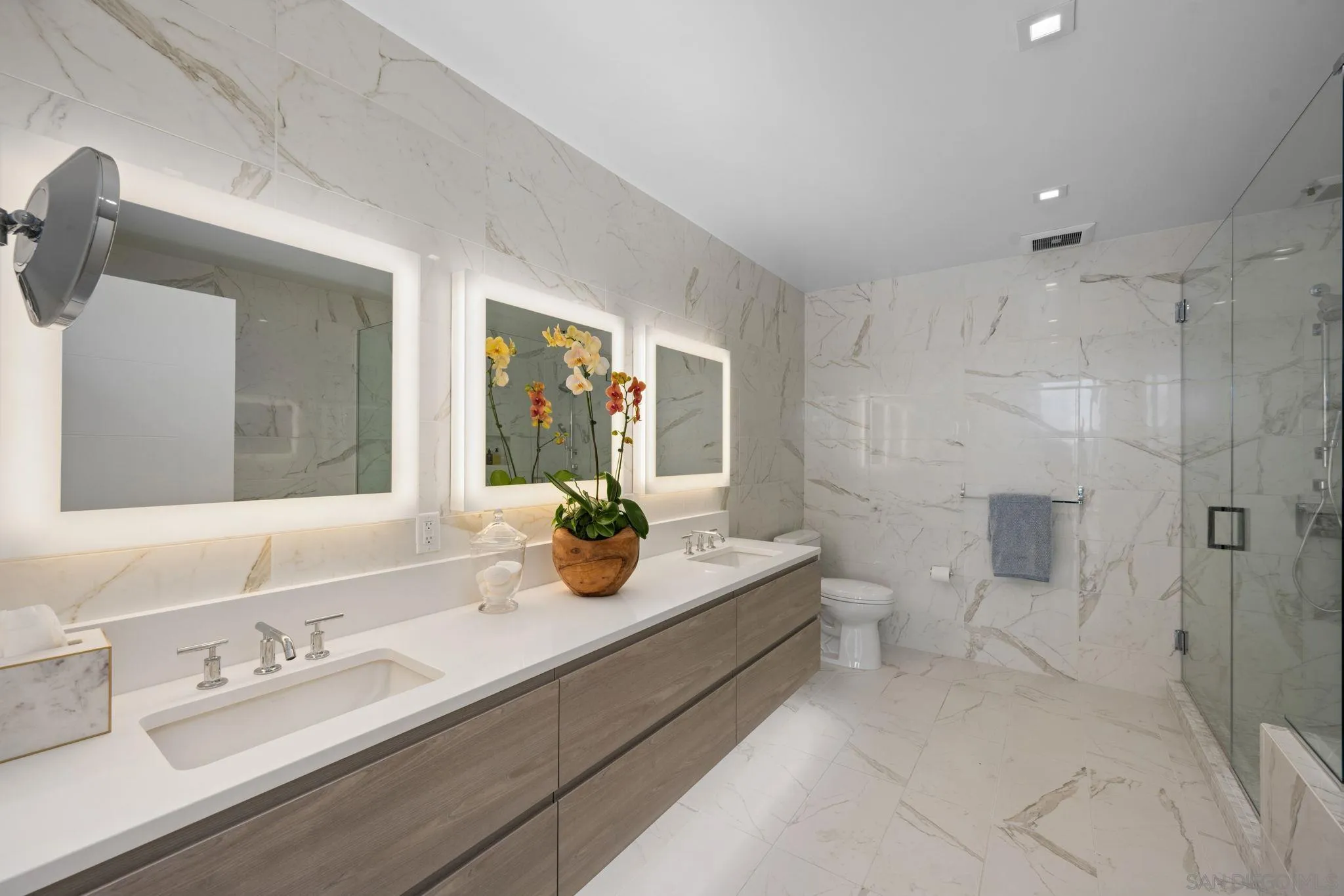 2604 Fifth Avenue, Unit 804 San Diego, CA 92103 - Photo 39 of 72 a bathroom with a granite countertop sink mirror and double