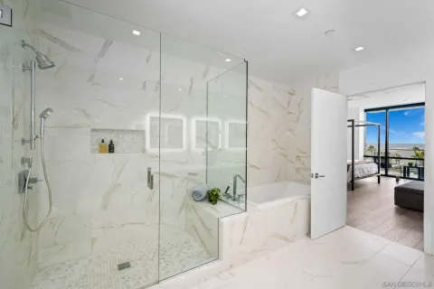 a living room with furniture large window and wooden floor