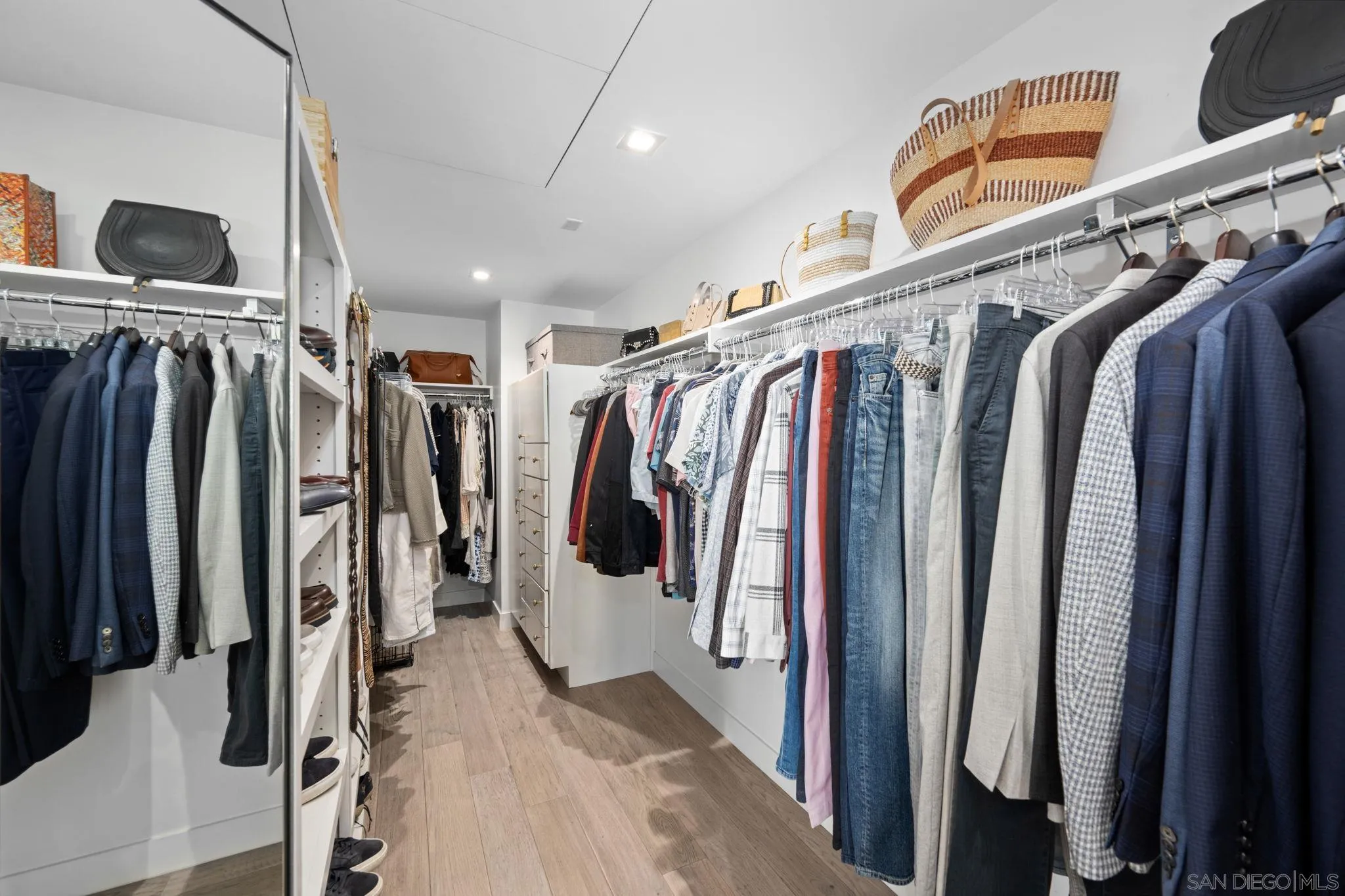 2604 Fifth Avenue, Unit 804 San Diego, CA 92103 - Photo 42 of 72 a view of walk in closet with clothes and shoes