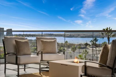 a view of a room with furniture and a large window