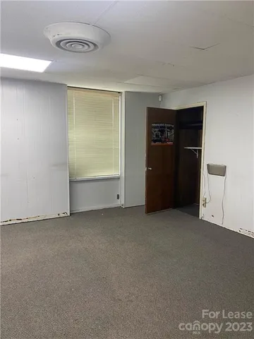 an empty room with an empty space and a window