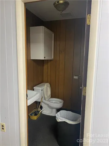 a bathroom with a toilet and a sink