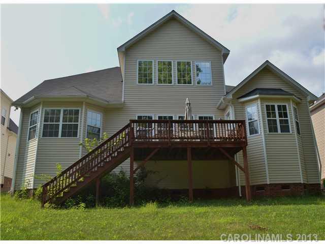 1705 Copperplate Road Charlotte, NC 28262 - Photo 11 of 14 a front view of a house with a garden