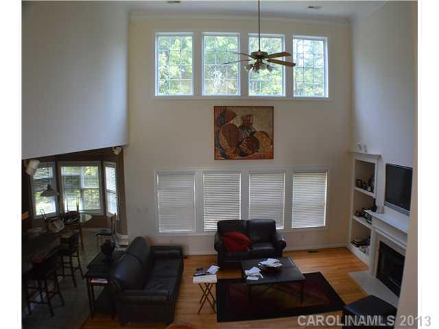 1705 Copperplate Road Charlotte, NC 28262 - Photo 3 of 14 a living room with furniture a window and a fireplace