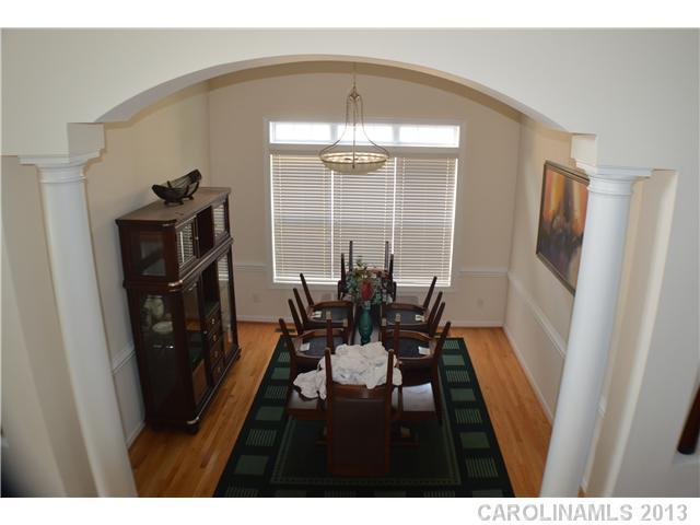 1705 Copperplate Road Charlotte, NC 28262 - Photo 4 of 14 a view of a dining room with furniture window and wooden floor