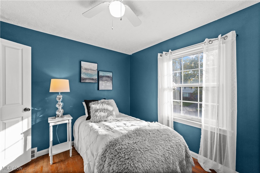 3690 Daleford Road Cleveland, OH 44120 - Photo 23 of 45 Bedroom with wood finished floors, a textured ceiling, and a ceiling fan