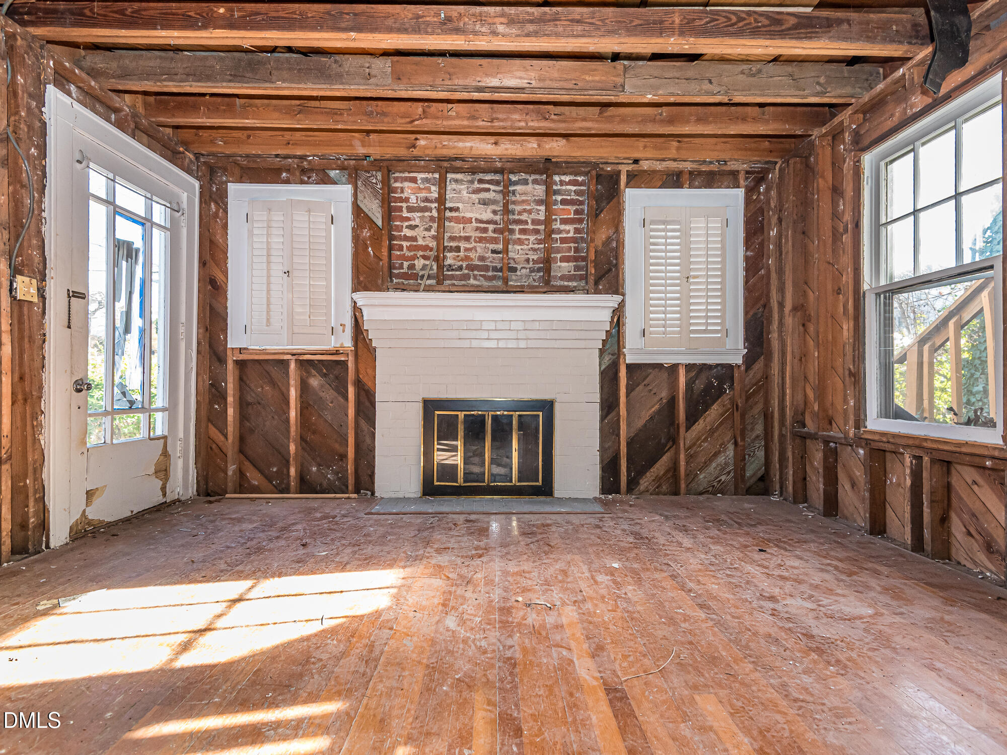 1825 White Oak Road Raleigh, NC 27608 - Photo 15 of 35 a view of an empty room with window and fire place