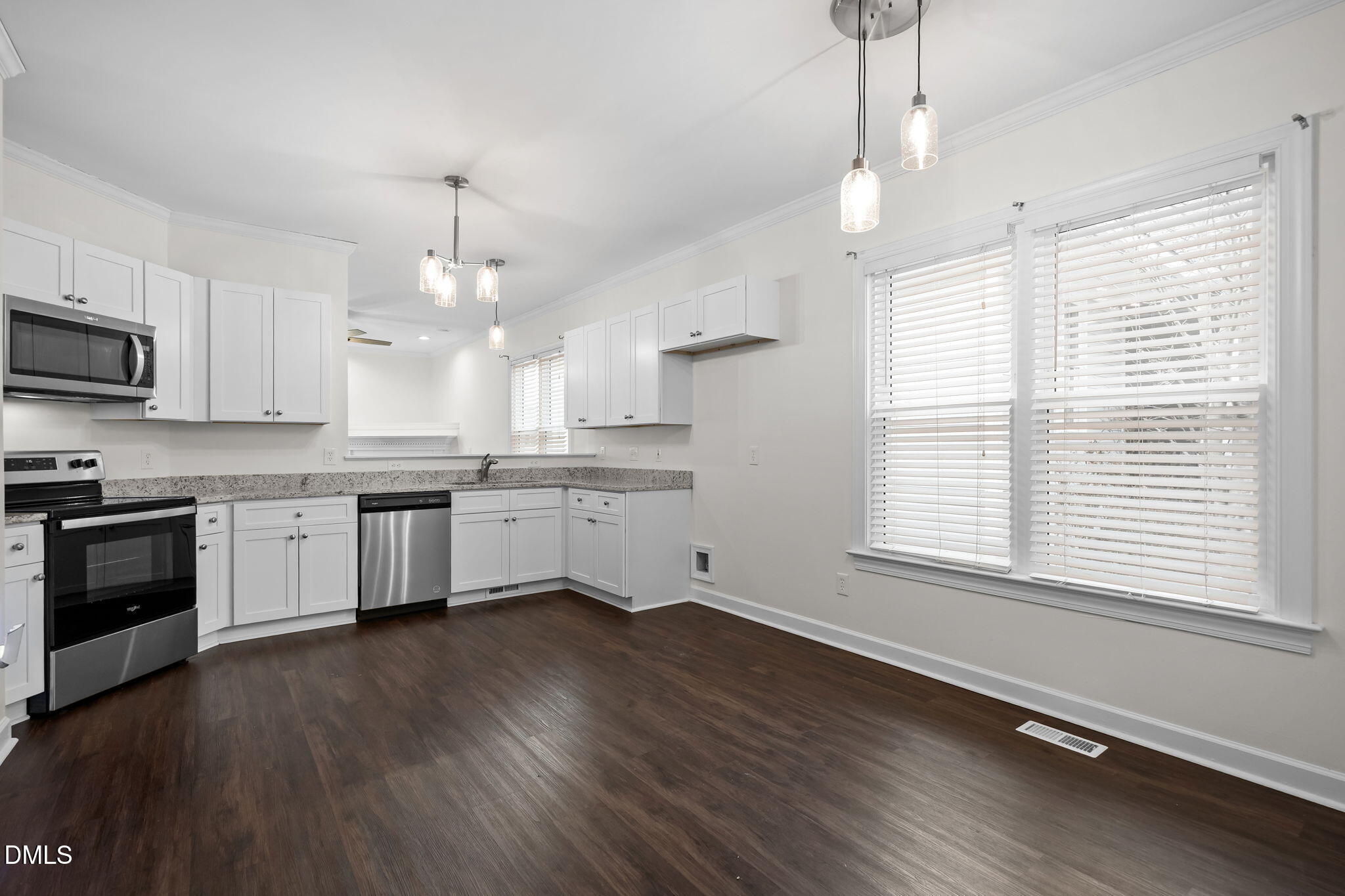 1953 Castle Pines Drive Raleigh, NC 27604 - Photo 14 of 47 a kitchen with a white cabinets and window