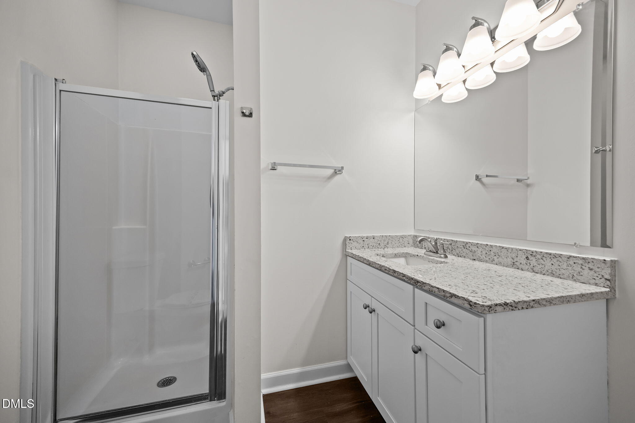 1953 Castle Pines Drive Raleigh, NC 27604 - Photo 17 of 47 a bathroom with a granite countertop sink a mirror and shower