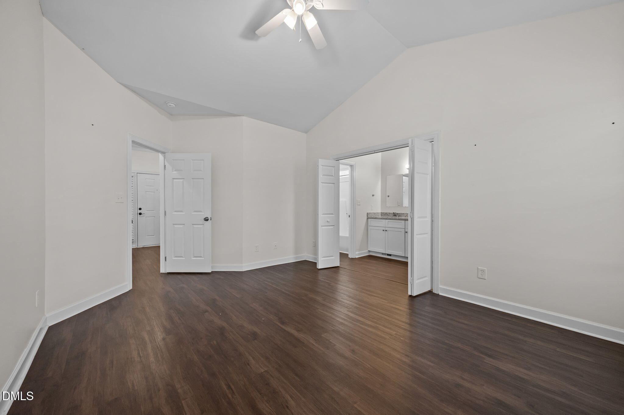 1953 Castle Pines Drive Raleigh, NC 27604 - Photo 19 of 47 a view of an empty room with wooden floor and a window