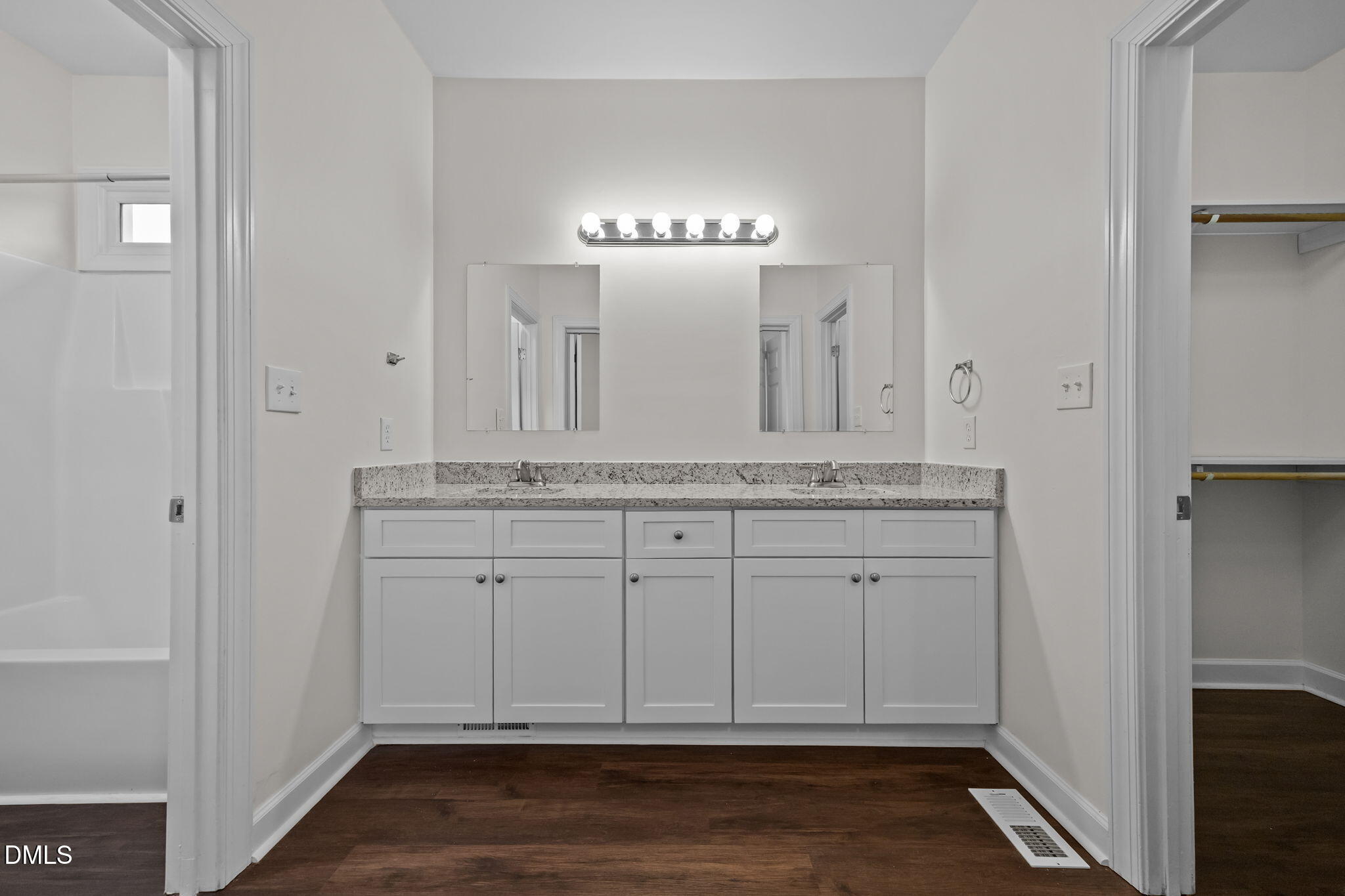 1953 Castle Pines Drive Raleigh, NC 27604 - Photo 20 of 47 a bathroom with a granite countertop sink and a mirror