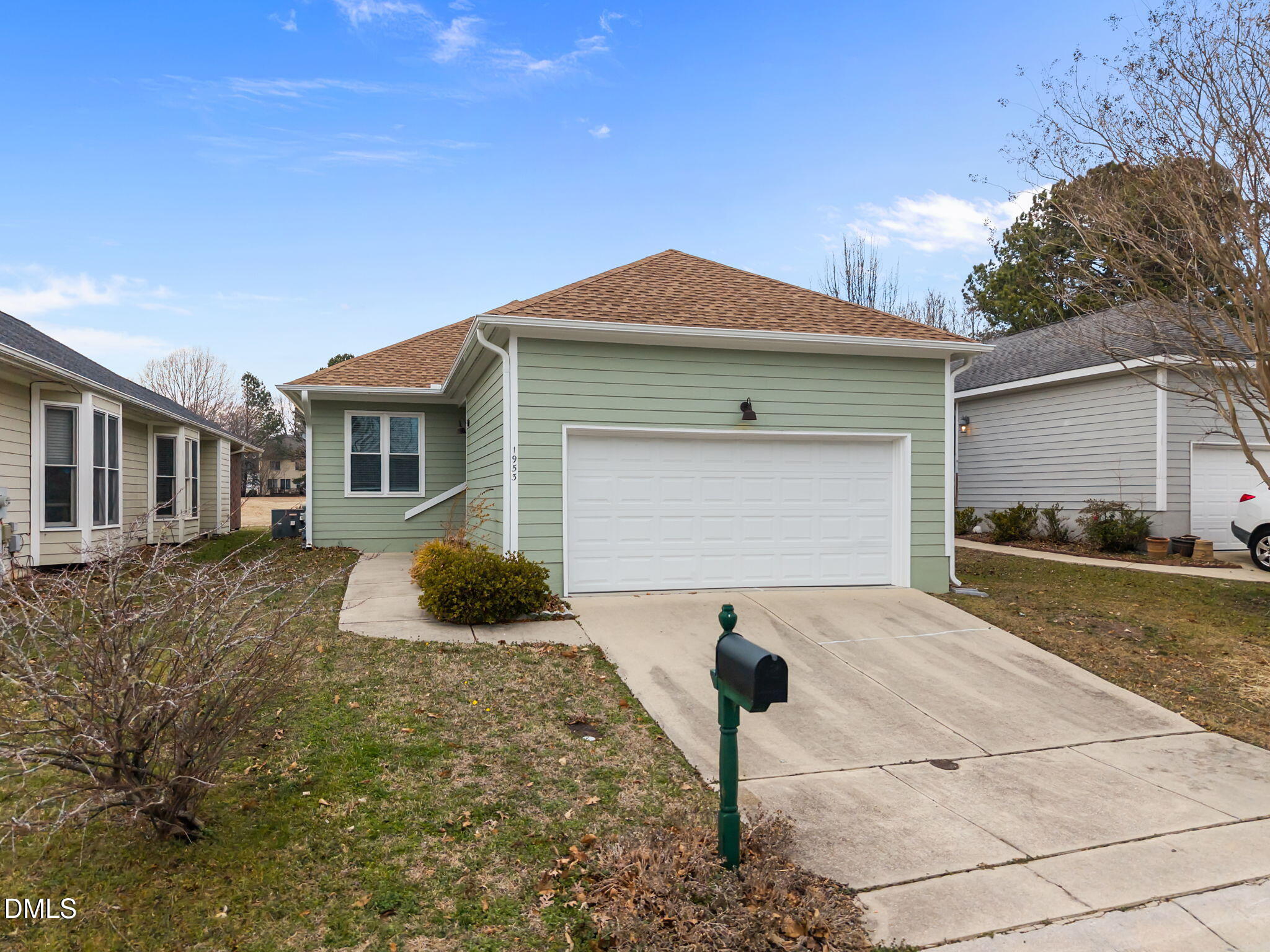 1953 Castle Pines Drive Raleigh, NC 27604 - Photo 2 of 47 a front view of a house with a yard and garage