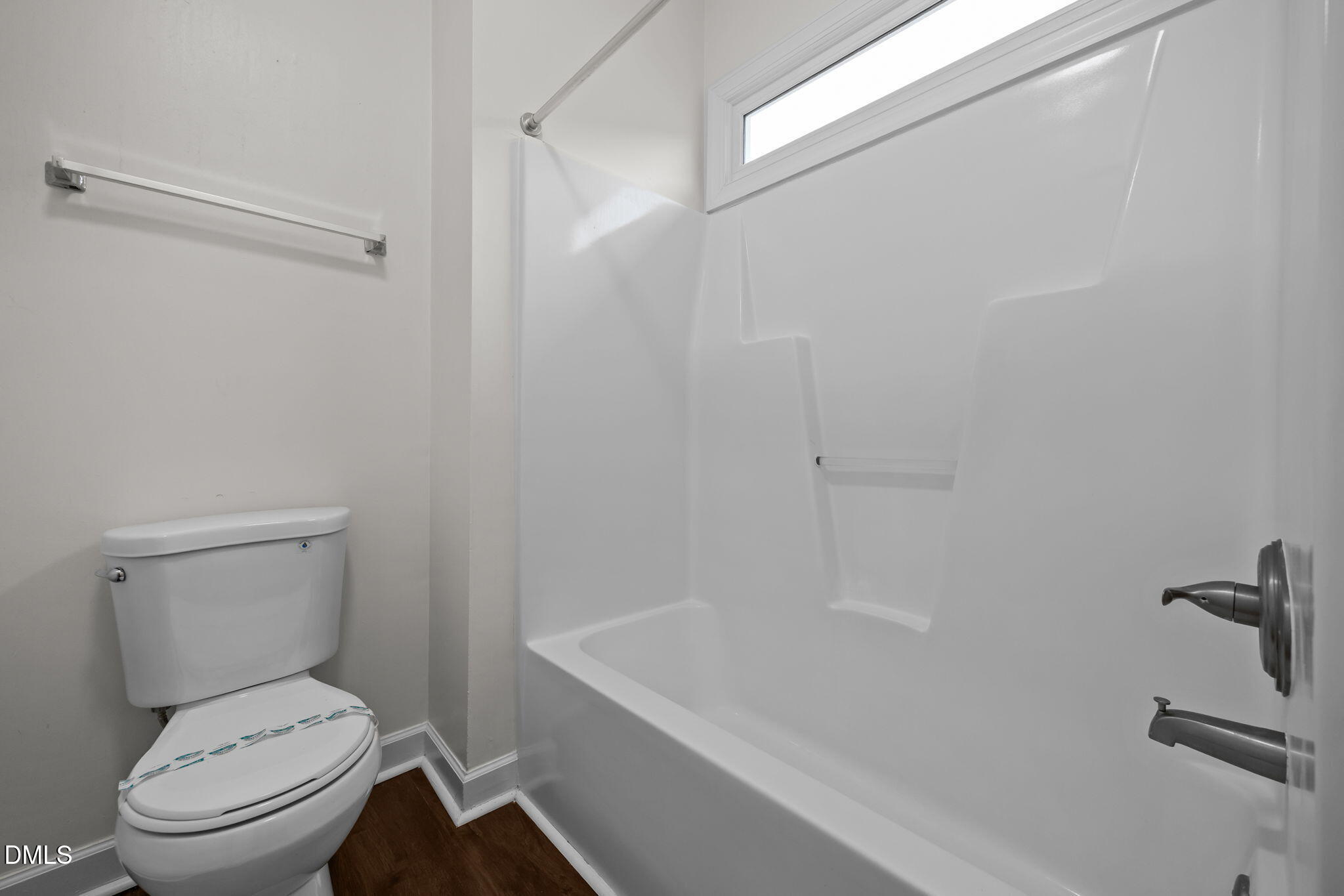 1953 Castle Pines Drive Raleigh, NC 27604 - Photo 23 of 47 a white toilet sitting next to a bath tub
