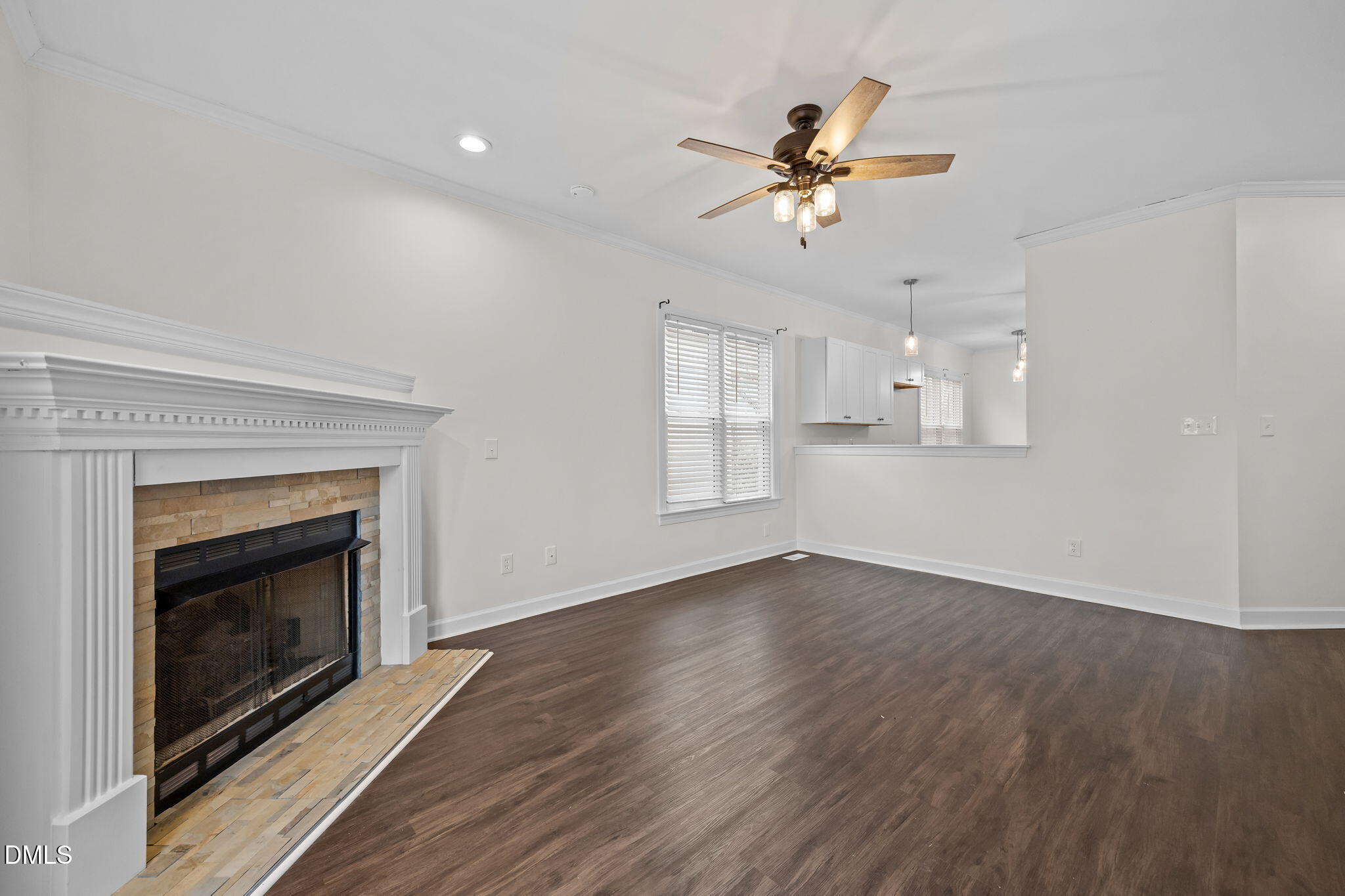 1953 Castle Pines Drive Raleigh, NC 27604 - Photo 28 of 47 a view of an empty room with wooden floor fireplace and a window