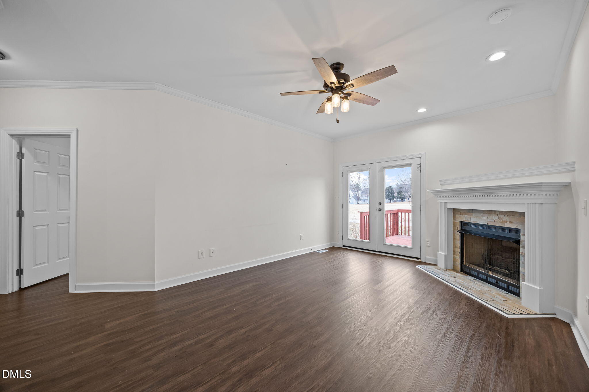 1953 Castle Pines Drive Raleigh, NC 27604 - Photo 30 of 47 a view of empty room with wooden floor and fireplace