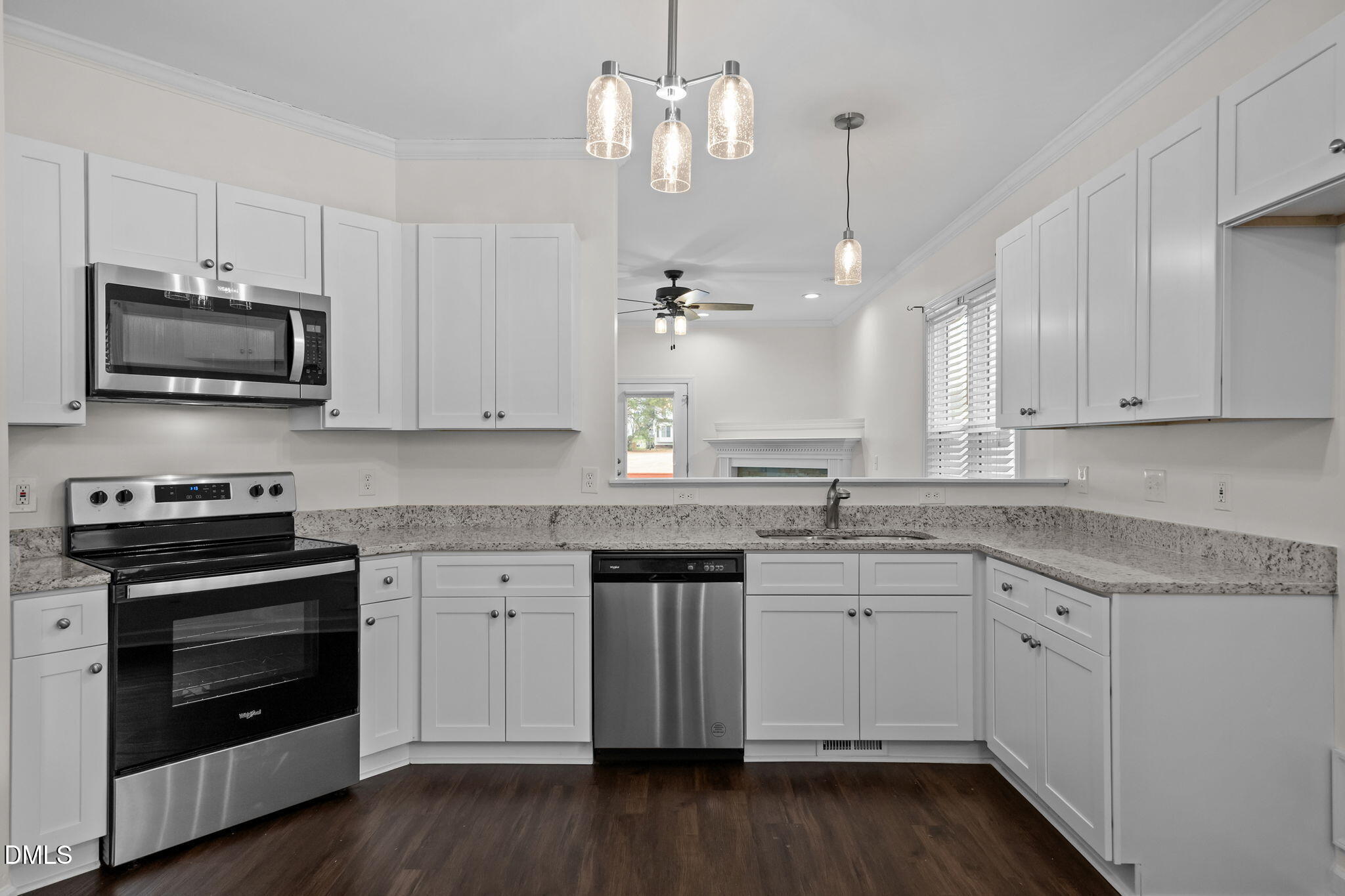 1953 Castle Pines Drive Raleigh, NC 27604 - Photo 9 of 47 a kitchen with a sink stove and microwave