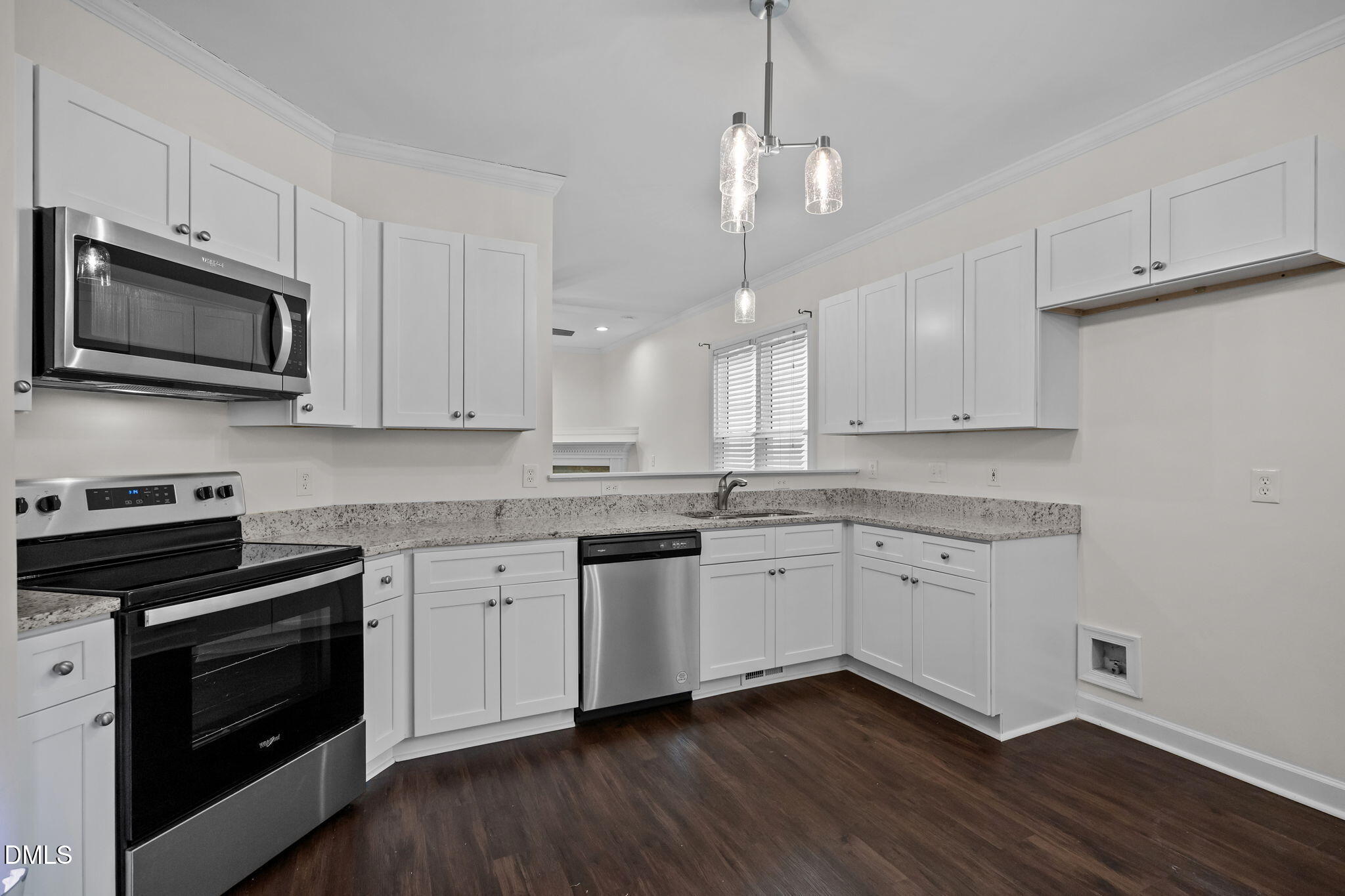 1953 Castle Pines Drive Raleigh, NC 27604 - Photo 10 of 47 a kitchen with granite countertop cabinets stainless steel appliances and wooden floor