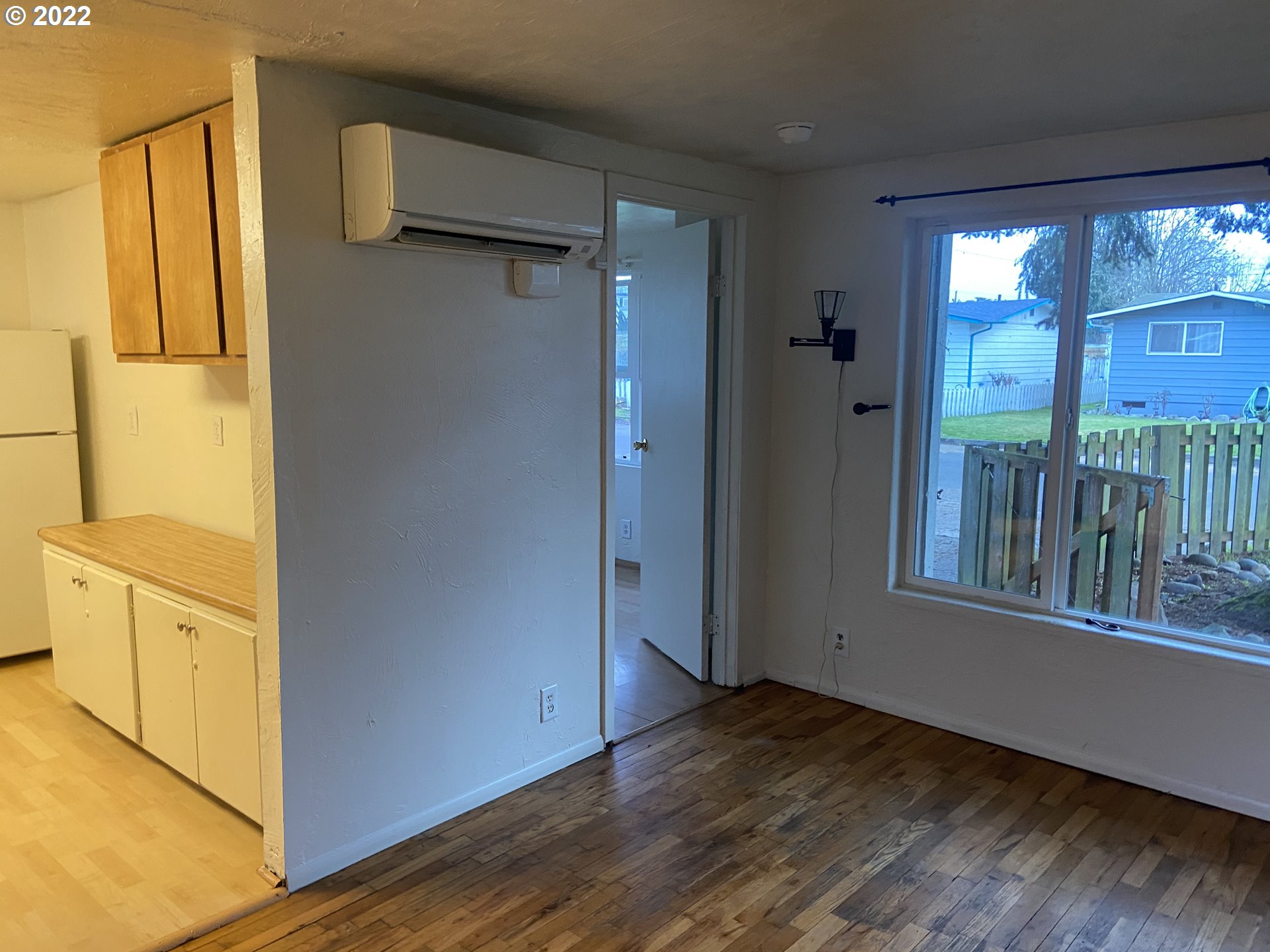 902 25th Place Springfield, OR 97477 - Photo 5 of 15 wooden floor in an empty room with a window