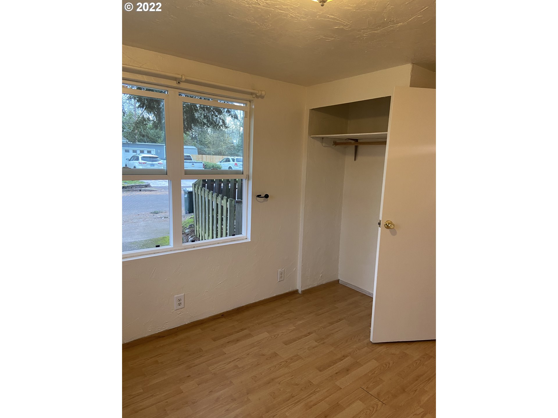 902 25th Place Springfield, OR 97477 - Photo 9 of 15 a view of an empty room with wooden floor and a window