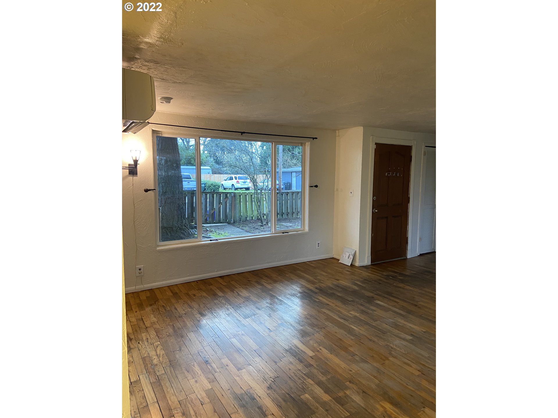 902 25th Place Springfield, OR 97477 - Photo 10 of 15 a view of an empty room with glass door