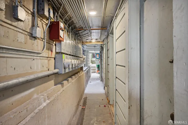 a view of staircase with wooden floor and white walls