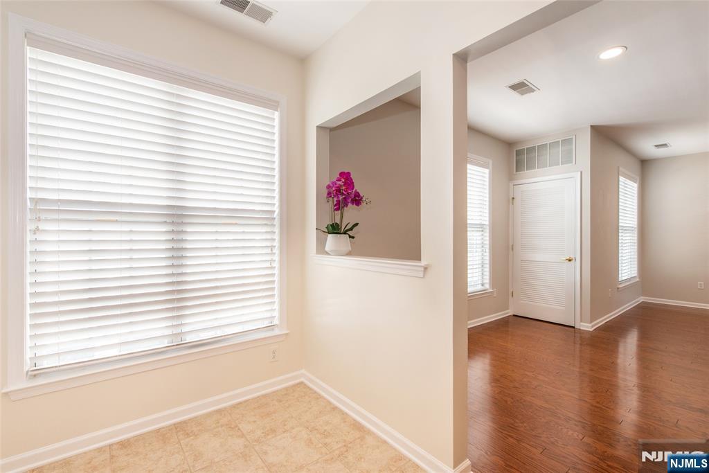 201 Dey Street, Unit 124 Harrison, NJ 07029 - Photo 15 of 26 a view of a room with wooden floor and a window