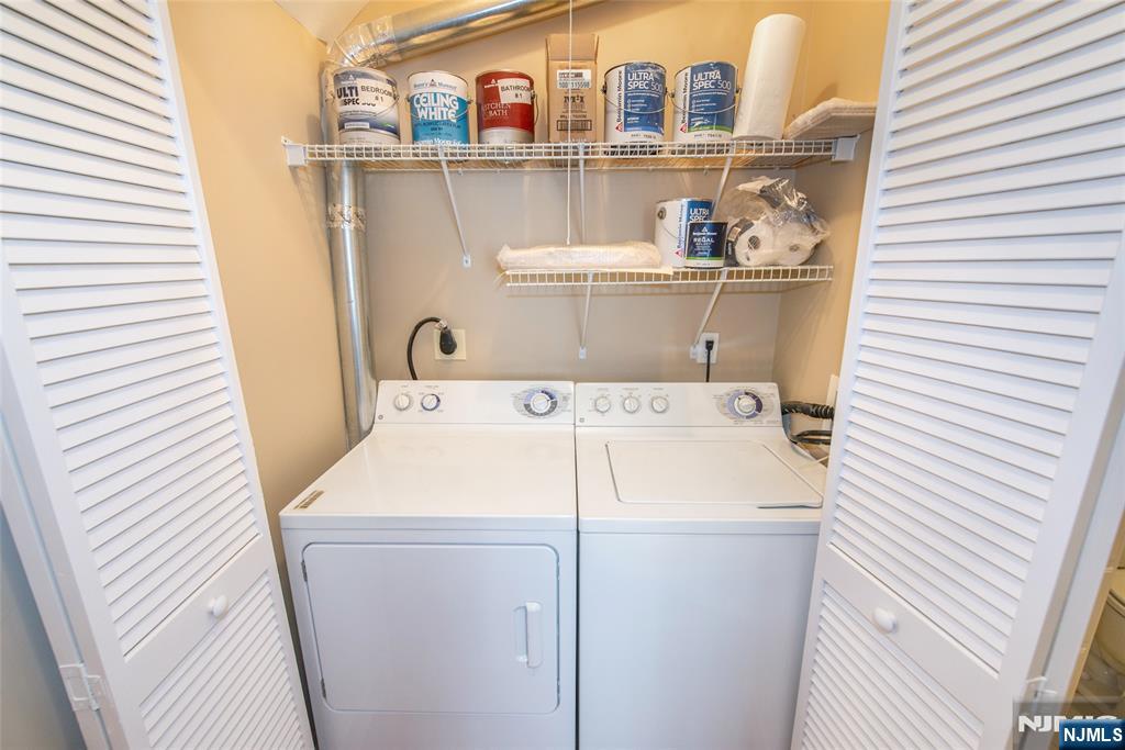 201 Dey Street, Unit 124 Harrison, NJ 07029 - Photo 16 of 26 a utility room with dryer and washer