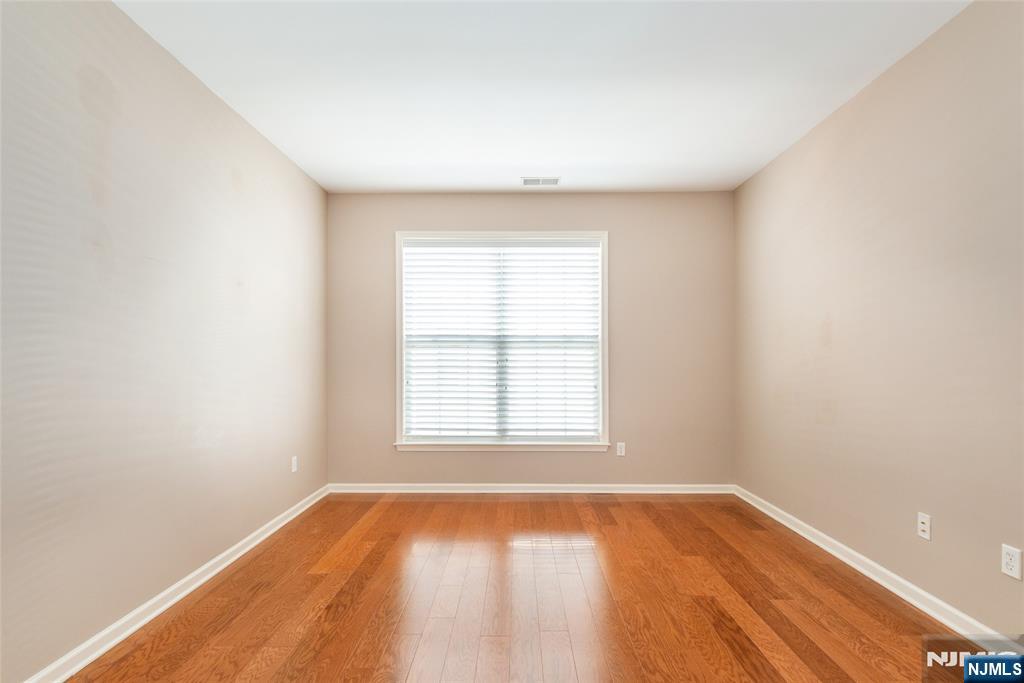 201 Dey Street, Unit 124 Harrison, NJ 07029 - Photo 18 of 26 an empty room with a window