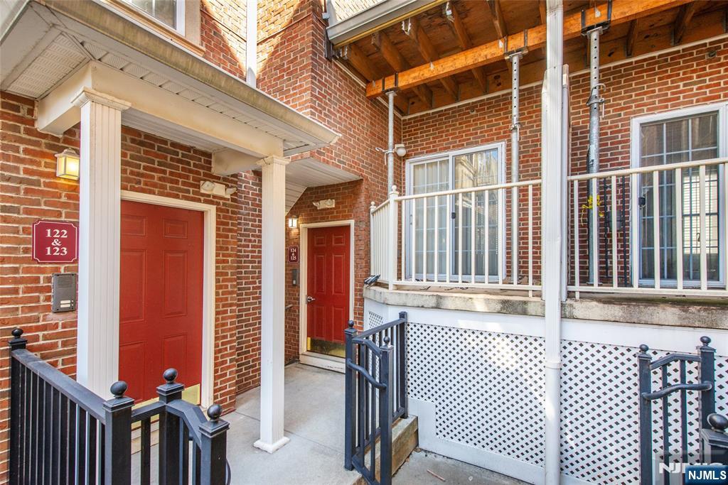 201 Dey Street, Unit 124 Harrison, NJ 07029 - Photo 4 of 26 a view of a brick house with a large window