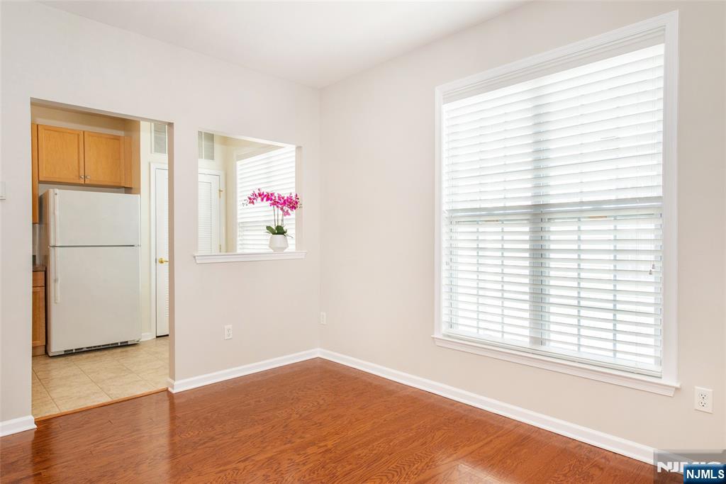 201 Dey Street, Unit 124 Harrison, NJ 07029 - Photo 10 of 26 a view of an empty room with a window