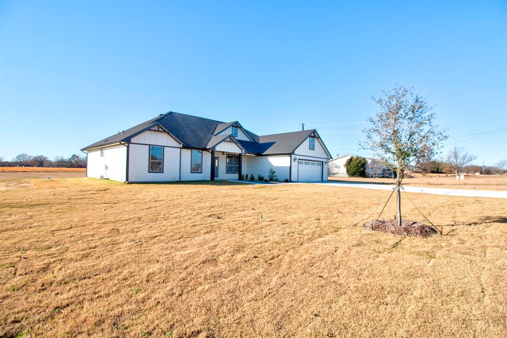 6180 Old Sherman Road Whitesboro, TX 76273 - Photo 2 of 30 a view of house with yard and ocean view