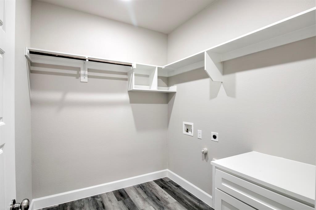 6180 Old Sherman Road Whitesboro, TX 76273 - Photo 19 of 30 Laundry room with washer hookup, electric dryer hookup, hookup for a gas dryer, and dark wood-style flooring