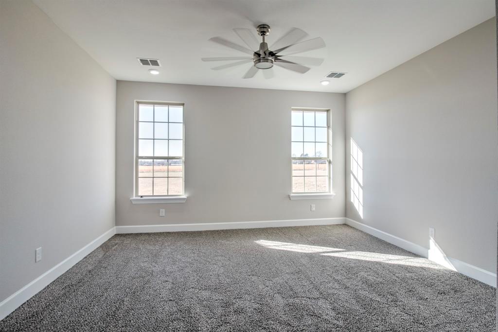 6180 Old Sherman Road Whitesboro, TX 76273 - Photo 22 of 30 a view of an empty room with a window