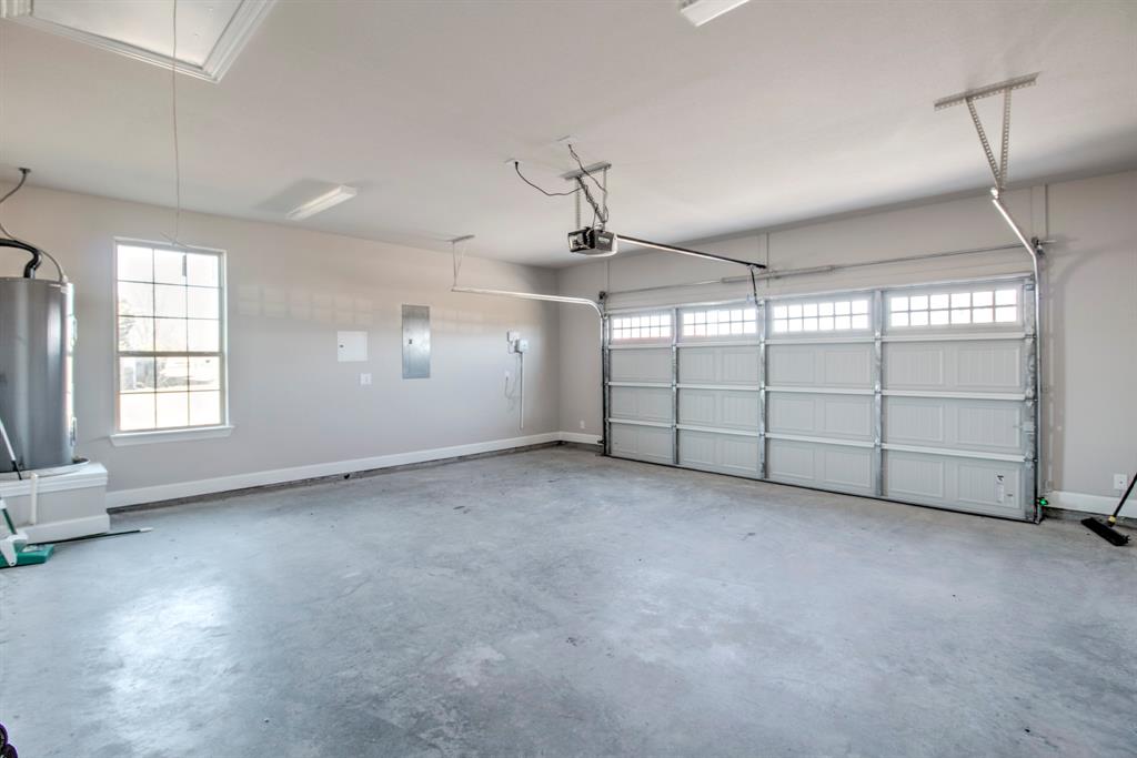 6180 Old Sherman Road Whitesboro, TX 76273 - Photo 25 of 30 an empty room with windows and ceiling fan