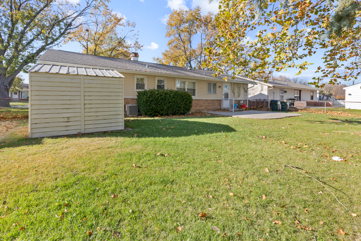 635 Love Street Elk Grove Village, IL 60007 - Photo 19 of 20 a front view of a house with a garden