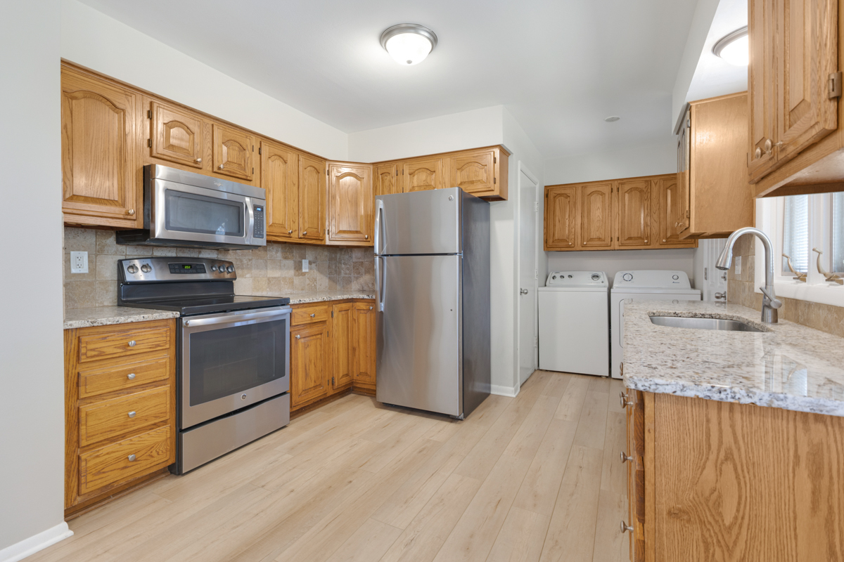 635 Love Street Elk Grove Village, IL 60007 - Photo 7 of 20 a kitchen with a refrigerator sink and microwave