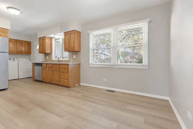 a view of kitchen with granite countertop cabinets and outdoor space