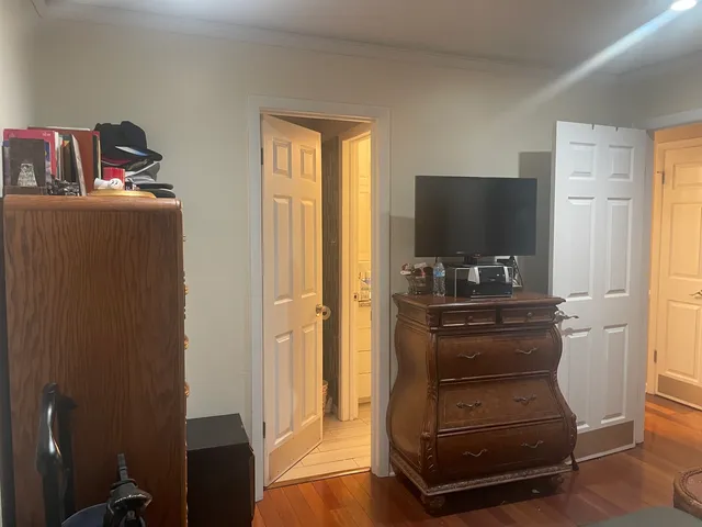 a room with furniture and a flat screen tv