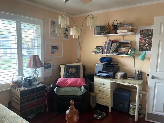 a bedroom with furniture and a dresser