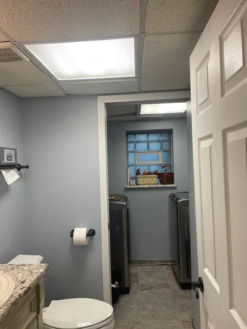 a bathroom with a toilet and a sink