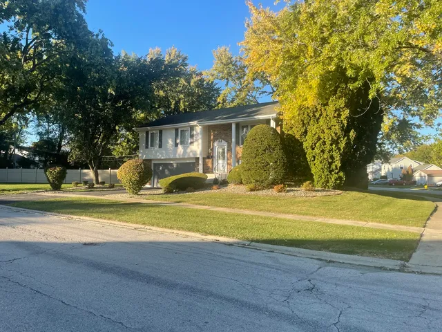 a view of a house with a yard and swimming pool