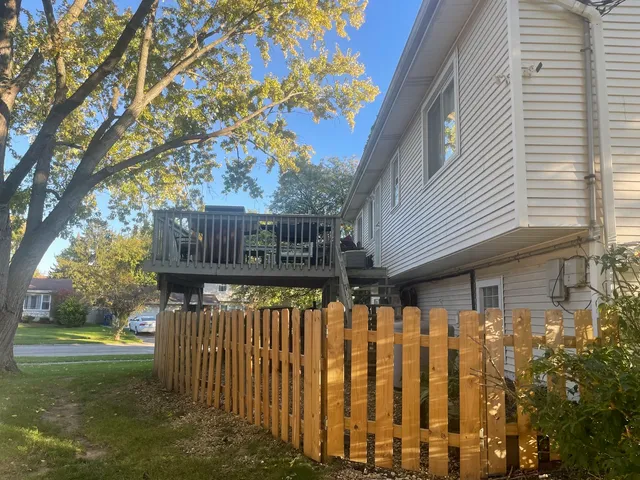 a front view of house with street sign