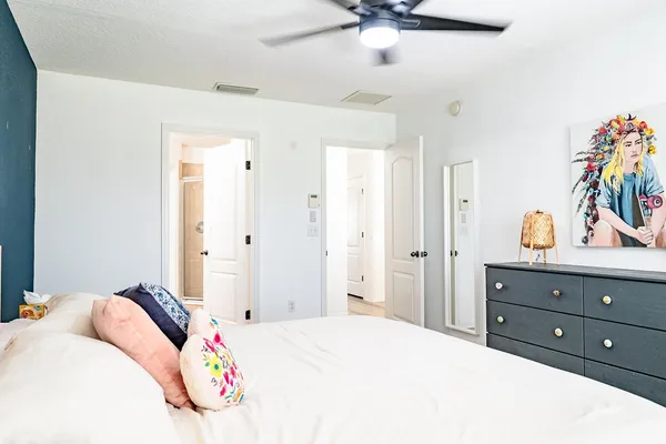 a bedroom with a bed and a dresser