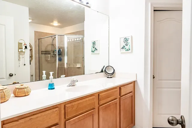 a bathroom with a sink and a mirror