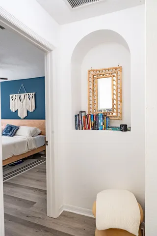 a bedroom with a bed and a window