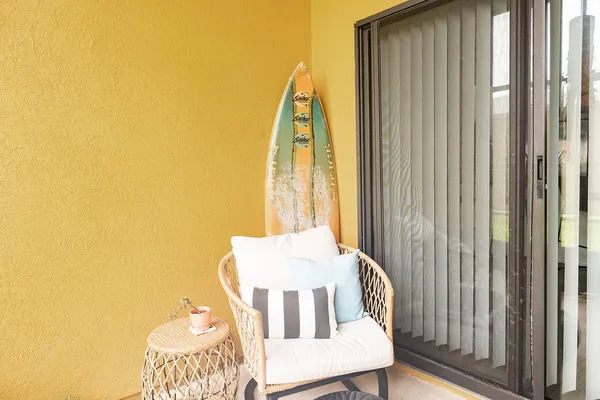 a view of a bedroom with a bed and wooden floor